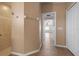 Bright hallway with tile floors connecting bathroom to bedroom at 5149 Latham Ter, Port Charlotte, FL 33981