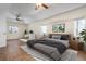 Bright bedroom featuring a workspace and tiled floors at 5149 Latham Ter, Port Charlotte, FL 33981