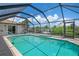 Enclosed pool and patio area offering privacy and views of the canal at 5149 Latham Ter, Port Charlotte, FL 33981