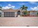 One-story home with a large garage and paver driveway at 5149 Latham Ter, Port Charlotte, FL 33981