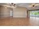 Open living area with tile floors and pool view at 5149 Latham Ter, Port Charlotte, FL 33981
