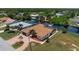 Aerial view of single-Gathering home with private driveway and landscaping at 5149 Latham Ter, Port Charlotte, FL 33981