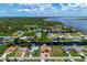 Single-Gathering home on a canal with a large lot and tropical landscaping at 5149 Latham Ter, Port Charlotte, FL 33981
