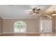 Spacious living room with tile floors and double doors at 5149 Latham Ter, Port Charlotte, FL 33981