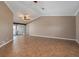Living room with tile floors, high ceilings, and access to a patio at 5149 Latham Ter, Port Charlotte, FL 33981