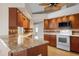 Modern kitchen with granite countertops and wood cabinets at 5149 Latham Ter, Port Charlotte, FL 33981