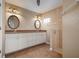 Elegant bathroom with double vanity, large mirror, and walk-in shower at 5149 Latham Ter, Port Charlotte, FL 33981