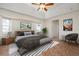 Spacious bedroom with tiled floors and a ceiling fan at 5149 Latham Ter, Port Charlotte, FL 33981