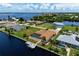 Aerial view of waterfront home with private pool and boat dock at 5149 Latham Ter, Port Charlotte, FL 33981