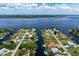 Single-Gathering home on a canal with a large lot and tropical landscaping at 5149 Latham Ter, Port Charlotte, FL 33981