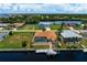 Aerial view of waterfront home with private pool and boat dock at 5149 Latham Ter, Port Charlotte, FL 33981