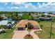Single-Gathering home on a canal with a large lot and tropical landscaping at 5149 Latham Ter, Port Charlotte, FL 33981