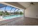 Relaxing pool area with screened enclosure and view of canal at 5149 Latham Ter, Port Charlotte, FL 33981
