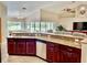Spacious kitchen with granite countertops and ample cabinetry at 530 Kensington St, Port Charlotte, FL 33954