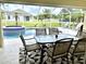 Inviting pool and spa area with screened enclosure at 530 Kensington St, Port Charlotte, FL 33954