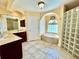 Elegant bathroom with double vanity, soaking tub, and walk-in shower at 530 Kensington St, Port Charlotte, FL 33954