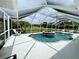 Inviting screened pool and spa with ample deck space for relaxation at 530 Kensington St, Port Charlotte, FL 33954