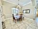 Bright dining room with chandelier and window seating at 530 Kensington St, Port Charlotte, FL 33954
