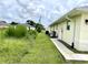 Side of house with AC unit and walkway at 530 Kensington St, Port Charlotte, FL 33954