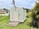 Convenient storage shed with wooden ramp access at 530 Kensington St, Port Charlotte, FL 33954