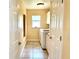 Laundry room with washer, dryer, and utility sink at 530 Kensington St, Port Charlotte, FL 33954