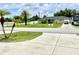 House exterior with driveway and street view at 530 Kensington St, Port Charlotte, FL 33954
