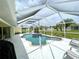 Relaxing screened pool and spa area, perfect for outdoor enjoyment at 530 Kensington St, Port Charlotte, FL 33954