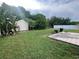 Backyard featuring a storage shed and patio at 1405 Dorchester St, Port Charlotte, FL 33952