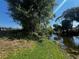 Lush backyard featuring a waterfront view at 1405 Dorchester St, Port Charlotte, FL 33952