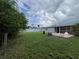 Spacious backyard featuring a patio and lush lawn at 1405 Dorchester St, Port Charlotte, FL 33952