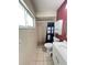 Bathroom with single sink vanity, toilet and stand-up shower at 1405 Dorchester St, Port Charlotte, FL 33952