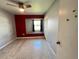 A neutral bedroom offers a window nook and ceiling fan at 1405 Dorchester St, Port Charlotte, FL 33952