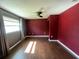 Well-lit bedroom offers a cozy ambiance with warm wood floors, neutral walls, and natural light at 1405 Dorchester St, Port Charlotte, FL 33952