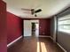 The bedroom provides wood floors, fan and a cozy window seat at 1405 Dorchester St, Port Charlotte, FL 33952
