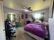 Bedroom featuring neutral walls, a ceiling fan, and natural lighting at 1405 Dorchester St, Port Charlotte, FL 33952