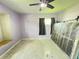 A bedroom with terrazzo floors, a built-in window seat, and space for a king bed at 1405 Dorchester St, Port Charlotte, FL 33952