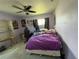 Cozy bedroom with ceiling fan, natural light, and potential for personalization at 1405 Dorchester St, Port Charlotte, FL 33952
