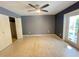 An empty bedroom with closet, french doors and ceiling fan at 1405 Dorchester St, Port Charlotte, FL 33952