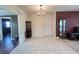 Inviting dining room with tile flooring and a decorative chandelier at 1405 Dorchester St, Port Charlotte, FL 33952