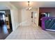 Dining room with tile floors, access to other areas of the home, and modern chandelier at 1405 Dorchester St, Port Charlotte, FL 33952