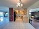 Bright kitchen with light wood cabinets, tile floors and modern appliances at 1405 Dorchester St, Port Charlotte, FL 33952
