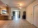 Bright kitchen with tile floors, oak cabinetry and stainless steel appliances with an eat-in dining area at 1405 Dorchester St, Port Charlotte, FL 33952
