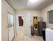 Utility area showcasing water heater and access to laundry hookups at 1405 Dorchester St, Port Charlotte, FL 33952