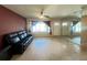 Open living room area featuring mirrored wall and large window providing plenty of natural light and backyard views at 1405 Dorchester St, Port Charlotte, FL 33952