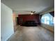 Cozy living room with terrazzo floors, a ceiling fan, and a spacious feel at 1405 Dorchester St, Port Charlotte, FL 33952