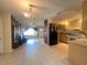 Open floor plan featuring seamless transition from kitchen to dining and living areas, showcasing modern design and flow at 1405 Dorchester St, Port Charlotte, FL 33952