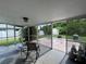 Enclosed back porch with a view of the backyard and storage shed at 1405 Dorchester St, Port Charlotte, FL 33952