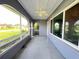 Enclosed patio offers a ceiling fan and protection from the elements at 1405 Dorchester St, Port Charlotte, FL 33952