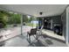 Relaxing screened patio area with chairs and backyard access at 1405 Dorchester St, Port Charlotte, FL 33952