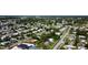 Aerial shot of a dense residential neighborhood with houses and trees at 8495 Cristobal Ave, North Port, FL 34287